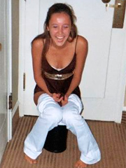 Pretty tanning teenager gets a tasty yellow rain surprise
