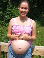 Blonde preggo gets strapon-fucked by knocked up black lesby and shares a dildo with her