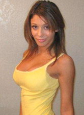 "the delightful nicole teasing her way out of her checked secretary outfit revealing her beige pantyhose"