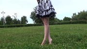 Foot fetish video of sexy shaped teen beauty showing her sexy feet while wlaking on the grass.