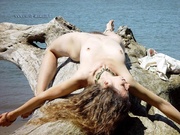 Mature,Hairy Hippie goddess shows her furry bush and fuzzy arm pits at the beach.